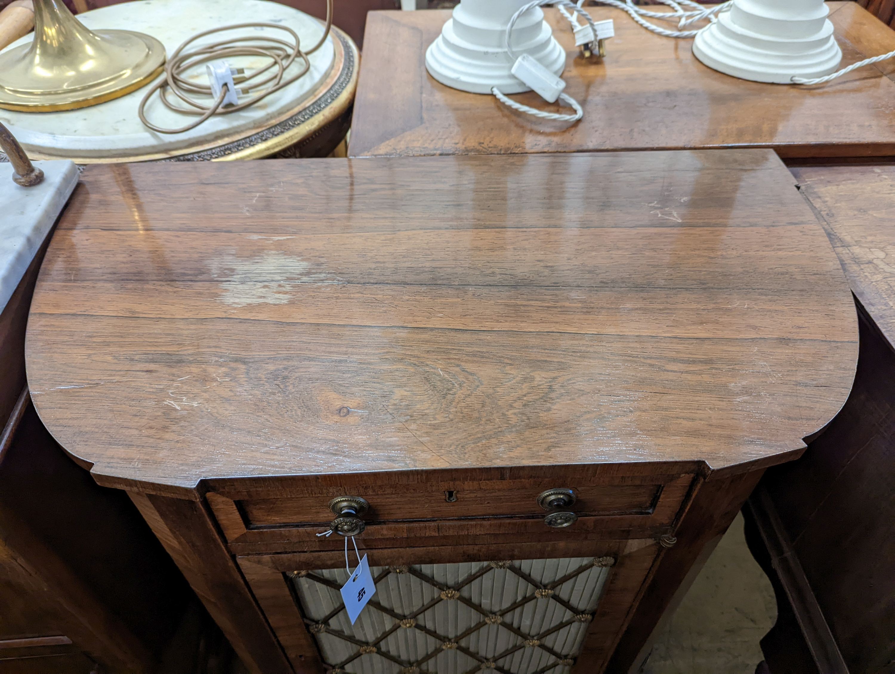 A small Regency style rosewood D shaped side cabinet, width 74cm, depth 41cm, height 77cm